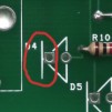 The black line of the diode should go to the side that is circled.