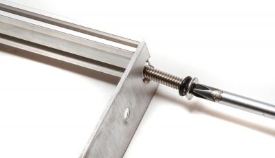 Screwing rail screws into bracket and rail